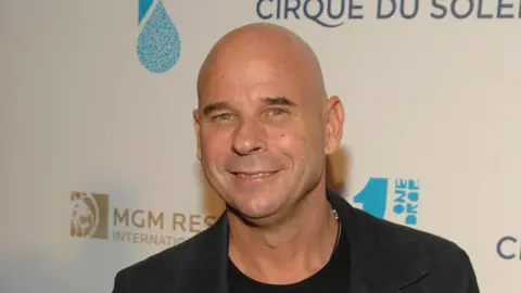 Getty Images Guy Laliberté smiles at a Cirque du Soleil event