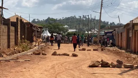 Madina Dahiru Maishanu/ BBC Road with stones on it