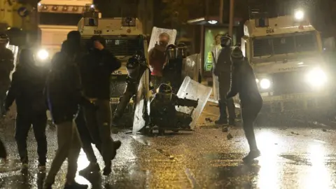 Charles McQuillan/Getty Images Nationalists attack police on Springfield Road just up from Peace Wall interface gates