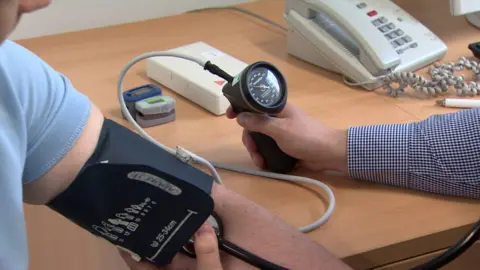 BBC Doctor taking blood pressure