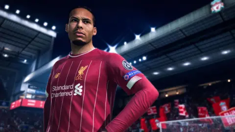 EA Sports An in-game character standing on a football pitch.