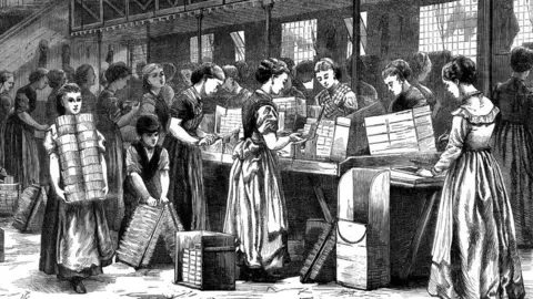 Getty Images Women and girls and a young boy at work in Bryant & May's match factory