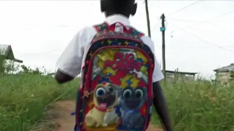 BBC A boy going to an illegal school in Douala, Cameroon