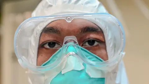 Getty Images File photo of a volunteers at the Covid Centre in Yangon