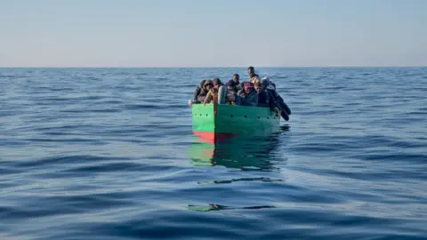 Getty Images Migrant boat off Tunisia coast