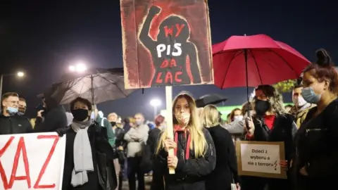 EPA A protester in Warsaw