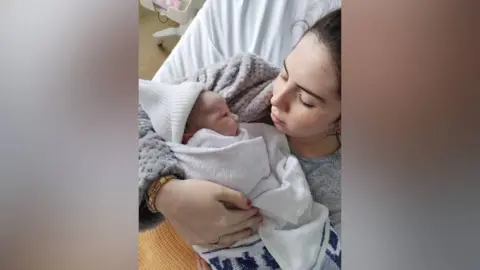 Kim Griffiths Freya and Rome enjoying a cuddle at home