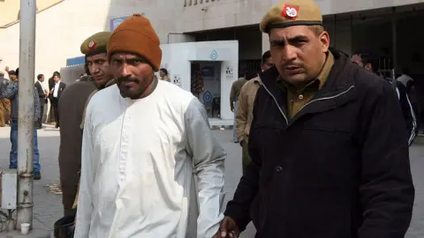 Getty Images Serial Killer Chandrakant Jha outside Rohini courts complex on Friday, 03 February, 2012. He came to court to record his statement in a murder case against him.