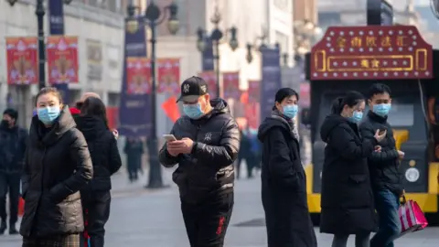 Getty Images China urged citizens to wear face masks in public places during the spring festival