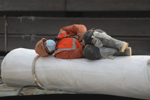 Getty Images A construction worker rests