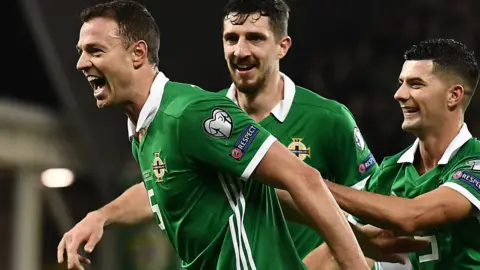 Jonny Evans celebrates his opener in Northern Ireland's 2-1 win over Belarus