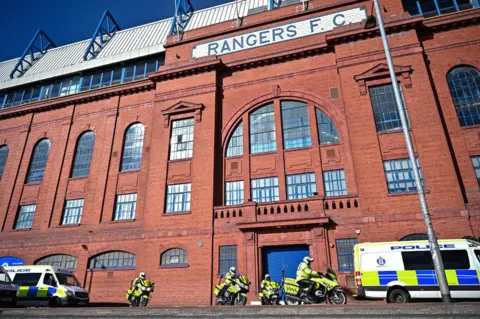 Getty Images Police were ready to be deployed outside Ibrox Stadium