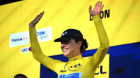 Marlen Reusser of Switzerland and Team Movistar celebrates in the yellow jersey after winning the time trial from Gevrey-Chambertin to Dijon