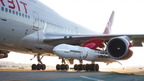 Virgin Orbit The LauncherOne rocket is carried aloft under the jumbo's port wing