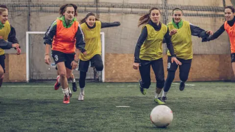 Getty Images Girls playing football