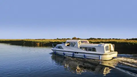 Getty Images A boat on the Norfolk Broads