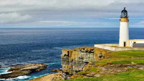 FrancisXT Lighthouse powered with solar energy, Westray, Orkney islands, Scotland - stock photo
