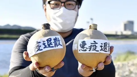 Getty Images Fireworks with a message praying for an end to pestilence