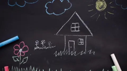 Getty Images Blackboard drawing of house