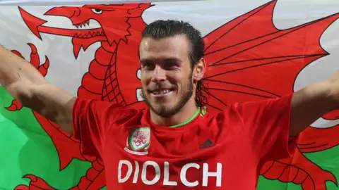 Getty Images Footballer Gareth Bale flying the flag for Wales