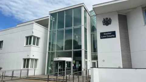 Exeter Law Courts - a white court building with a large glass entrance.
