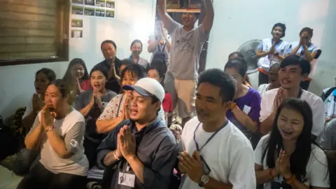 Getty Images Relatives of the missing boys pray for them after the 12 boys and their soccer coach have been found alive