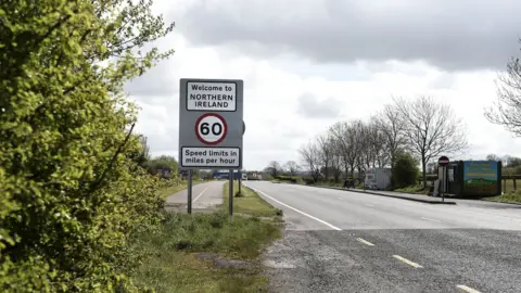 Getty Images/Charles McQuillan Road sign marking border between Northern Ireland and the Republic of Ireland