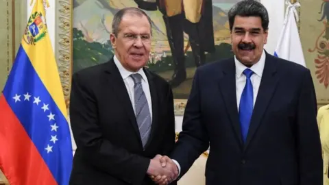 AFP/Getty Images Russian Foreign Minister Sergei Lavrov (left) and Venezuelan President Nicolás Maduro in Caracas. Photo: 7 February 2020