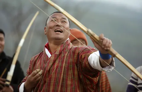 Getty Images Only men are allowed to compete in Bhutanese traditional archery