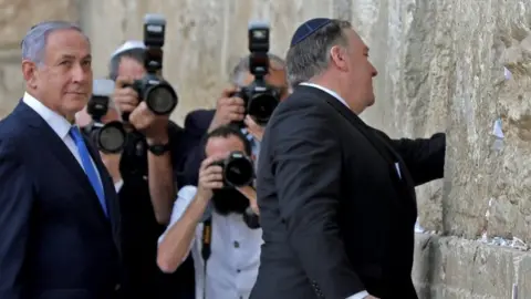 Alamy Israeli Prime Minister Benjamin Netanyahu (L) stands by as US Secretary of State Mike Pompeo (R) prays at the Western Wall in Jerusalem's Old City on 21 March 2019,