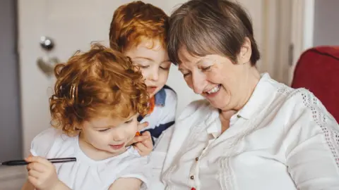 SolStock Grandmother and grandchildren