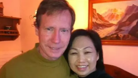 Newport Police Department Peter Chadwick and his wife Qee Choo