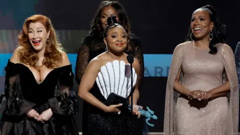 Getty Images Lisa Ann Walter, Quinta Brunson, Janelle James, and Sheryl Lee Ralph accept the Outstanding Performance by an Ensemble in a Comedy Series award for "Abbott Elementa" onstage during the 29th Annual Screen Actors Guild Awards at Fairmont Century Plaza on February 26, 2023 in Los Angeles, California