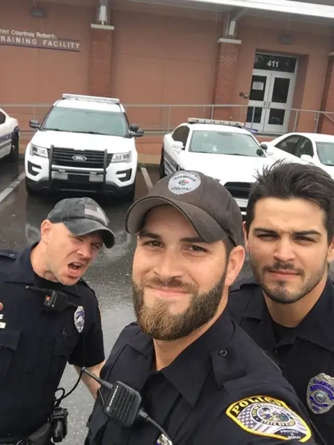 Facebook/Gainesville Police Department Viral photo of Gainesville police officers helping out with Irma posted on Facebook