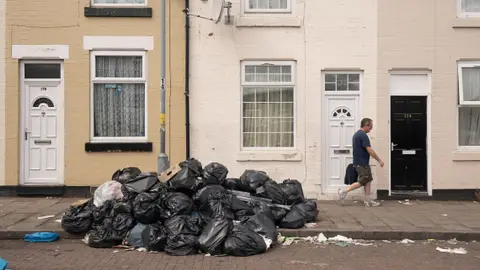 Getty Images Bin bags piled up in Alum Rock, Birmingham