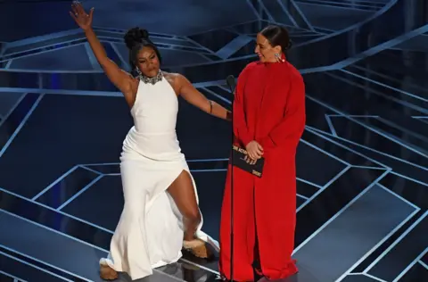 AFP Tiffany Haddish and Maya Rudolph on stage