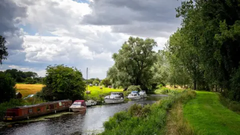 Getty Images A general view of barges and boats on the River Great Ouse near Southery, Cambridgeshire