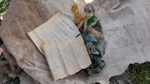 Scunthorpe Litter Pickers The letters alongside a smashed bottle