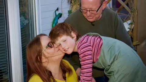 BBC Foster parents Sally and Barry Wood with Martha