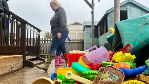 Linsey Smith / BBC Cleaning up damaged classroom