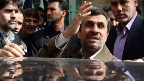 AFP/Getty Images Mahmoud Ahmadinejad waves to supporters outside a polling station in Tehran, in a 2012 picture.