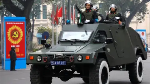 Reuters Soldiers with armoured vehicle