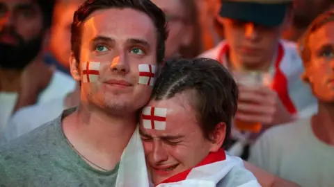 Reuters Devastated fans on Brighton Beach