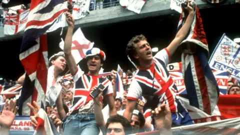 Neville Chadwick Photography England fans in the stadium wave - and wear - the Union Jack as England take on Czechoslovakia at the 1982 World Cup