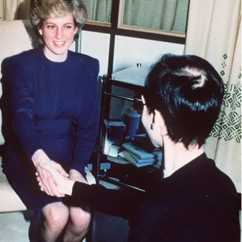 Getty Images Diana, Princess of Wales shakes hands with an Aids victim as she opened a new Aids ward at London's Middlesex Hospital on April 9, 1987.