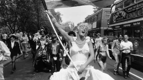 Getty Images A marcher dressed as Marilyn Monroe during the annual Gay Pride march in London, July 1994