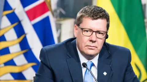 Scott Moe looks on as prime ministers of the Canadian provinces gather during a meeting set-up by Canada prime minister Justin Trudeau in Montreal, on December 7, 2018