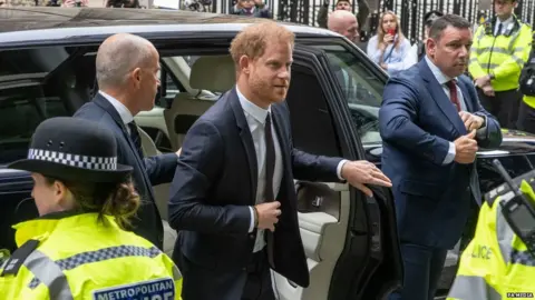 PA Media Prince Harry arrives at court