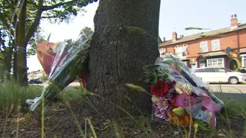 BBC Floral tributes at the scene