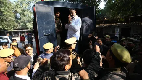 Getty Images Gangester turned Politician Mukhtar Ansari taken out from district court ifor money laundring case , in Allahabad on December 28,2022.